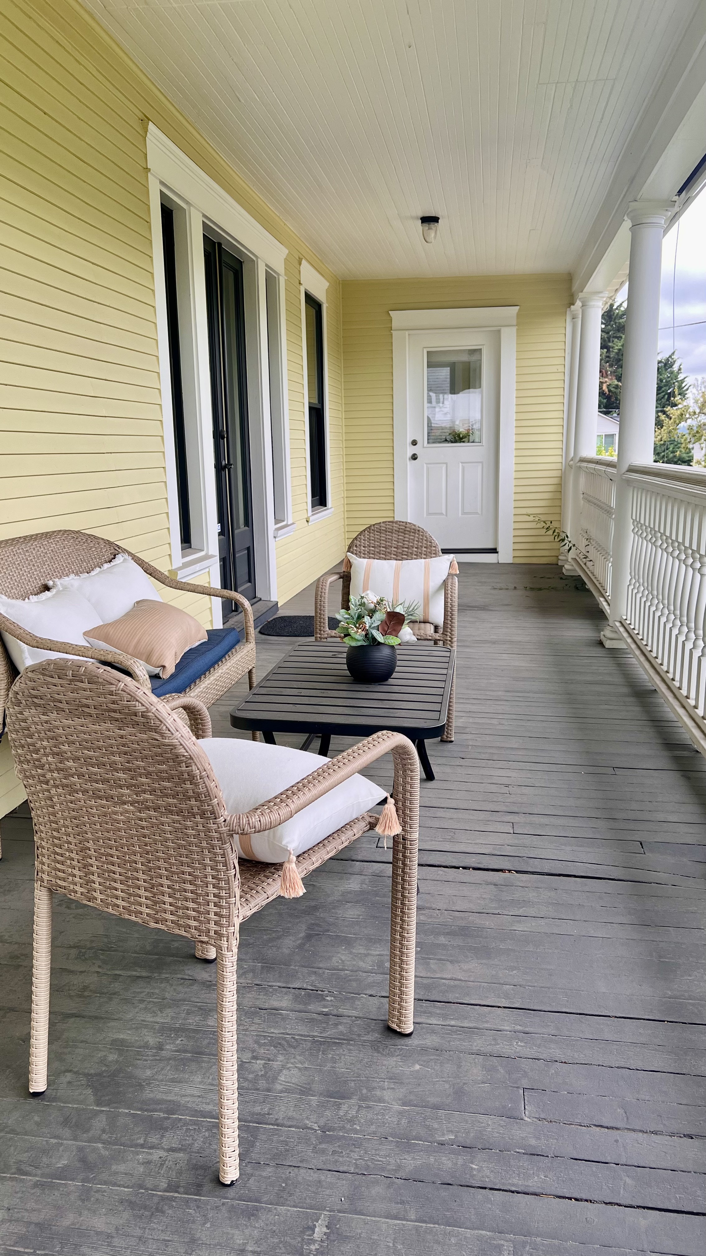 Wrap around porch for summer sunsets Shared common spaces in a grand Seattle Mansion