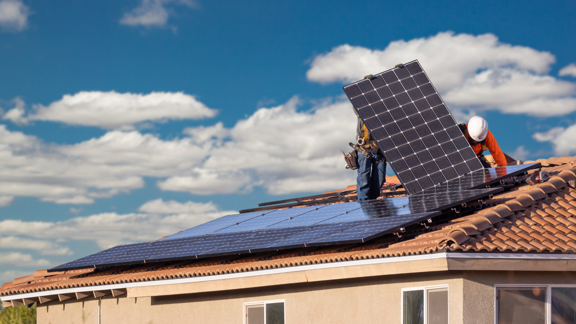 men installing solar panels