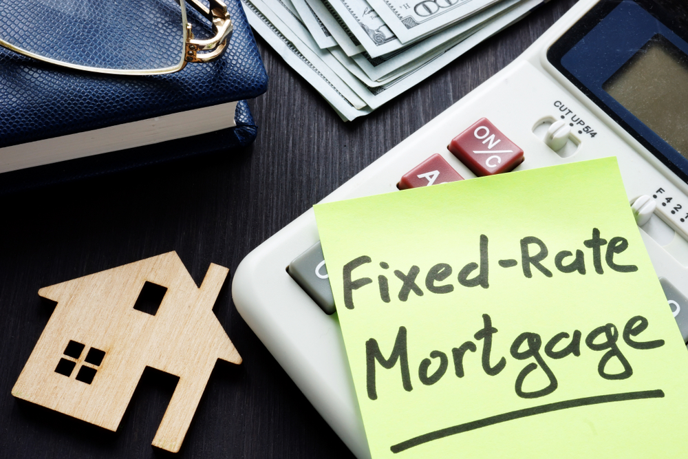fixed rate mortgage written on stamp it placed on a calculator