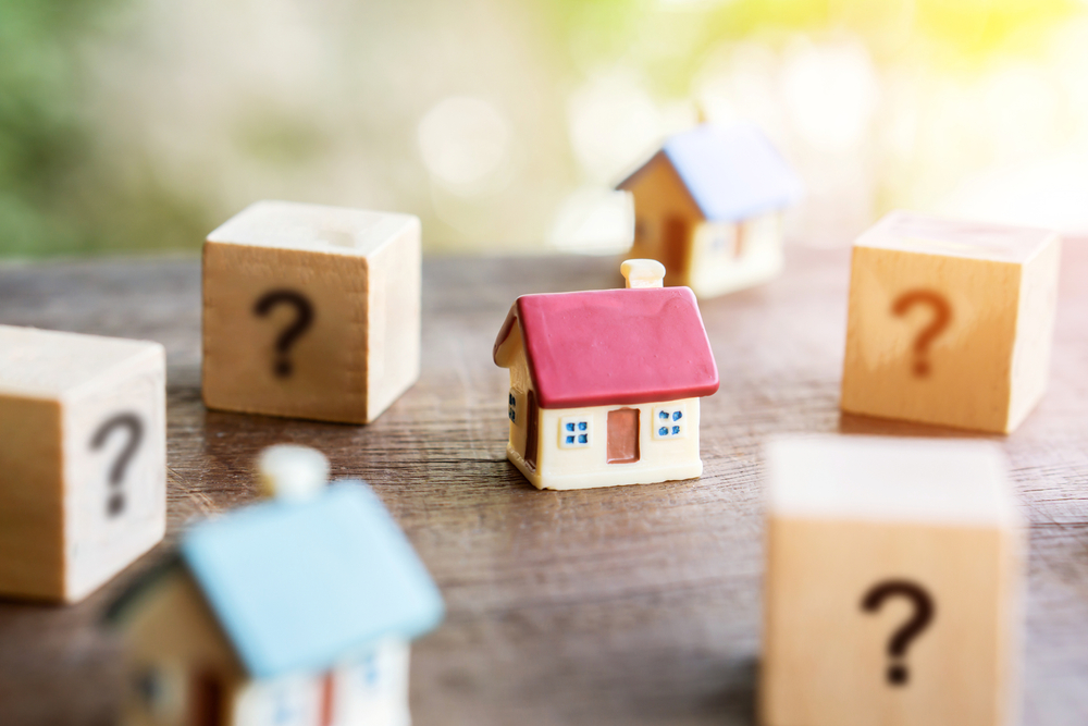 blocks with questions mark and small house