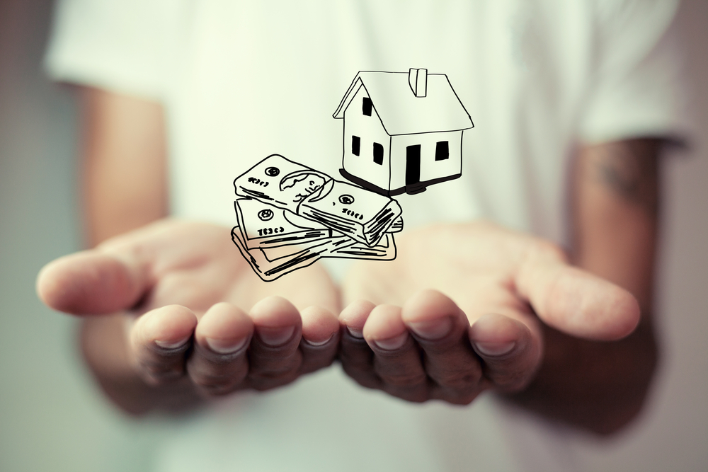 dollar bills and house sketch