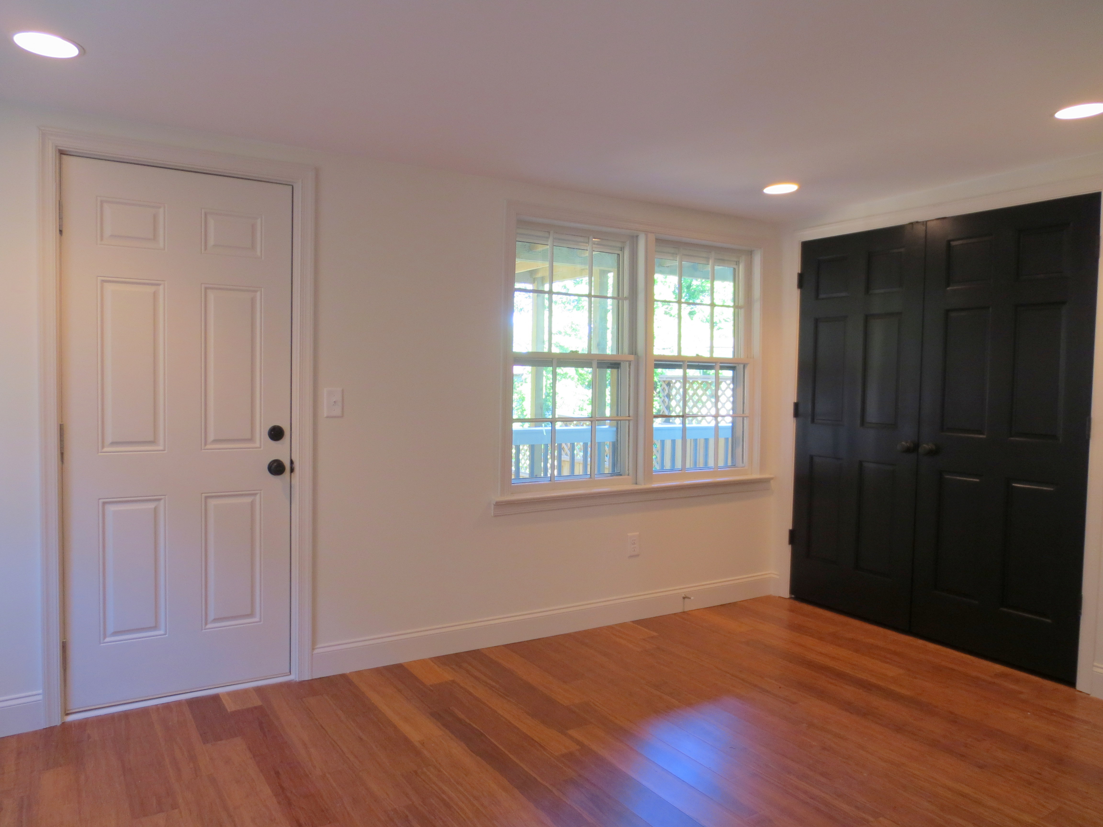 The Landmark restored apartment bedroom leading to yard