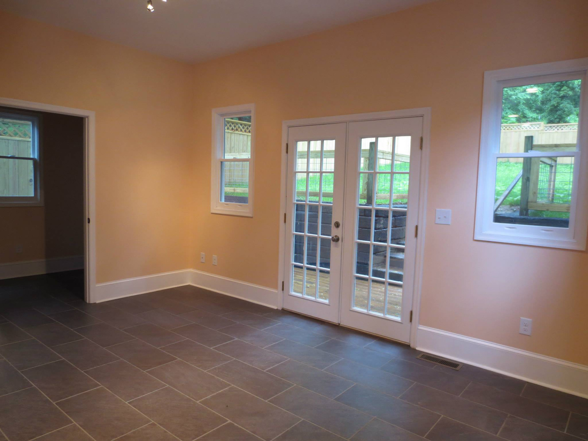 619 frederick st after renovation - french doors to the backyard