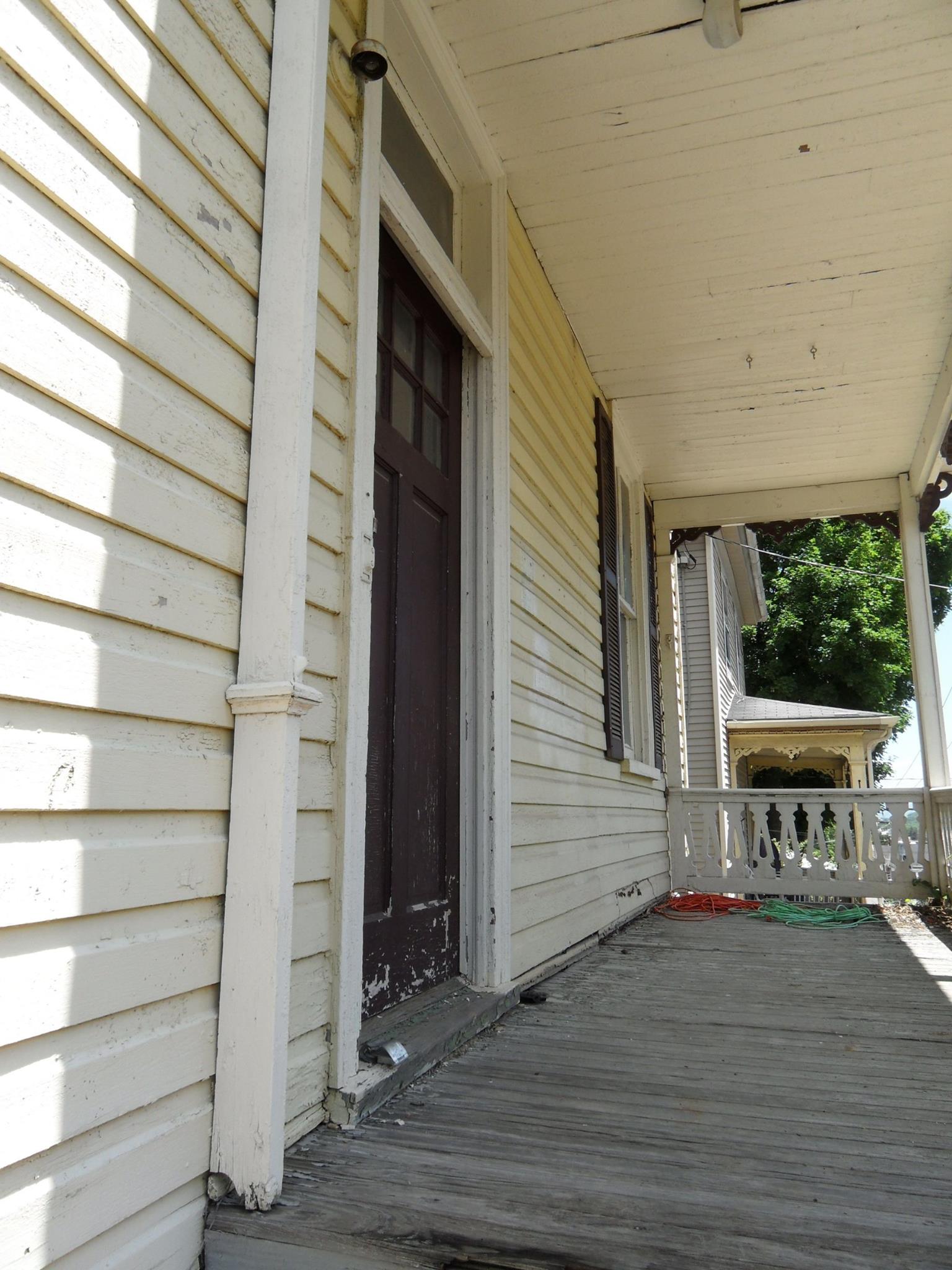 619 frederick st before renovation - front porch