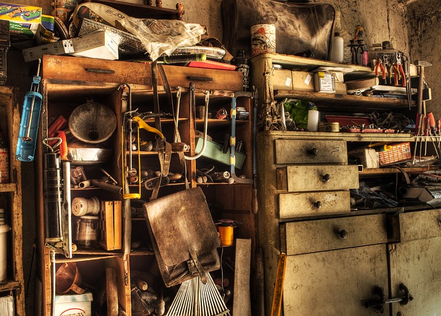 Garage wall covered in clutter and tools