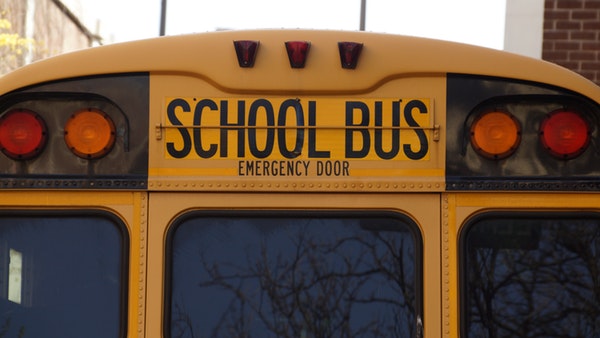 The back door of a big yellow school bus