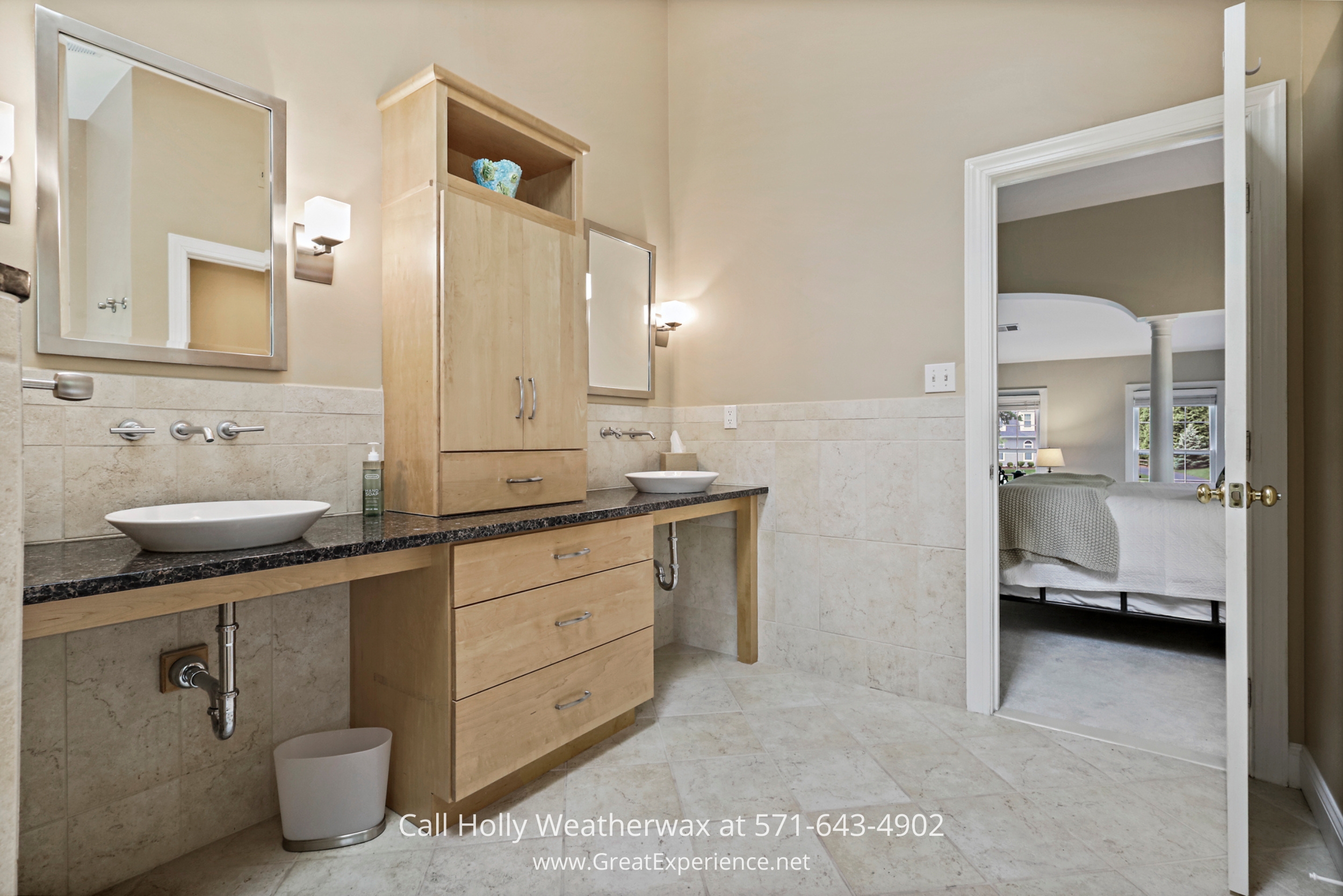 Modern bathroom with dual sinks and a stylish mirror