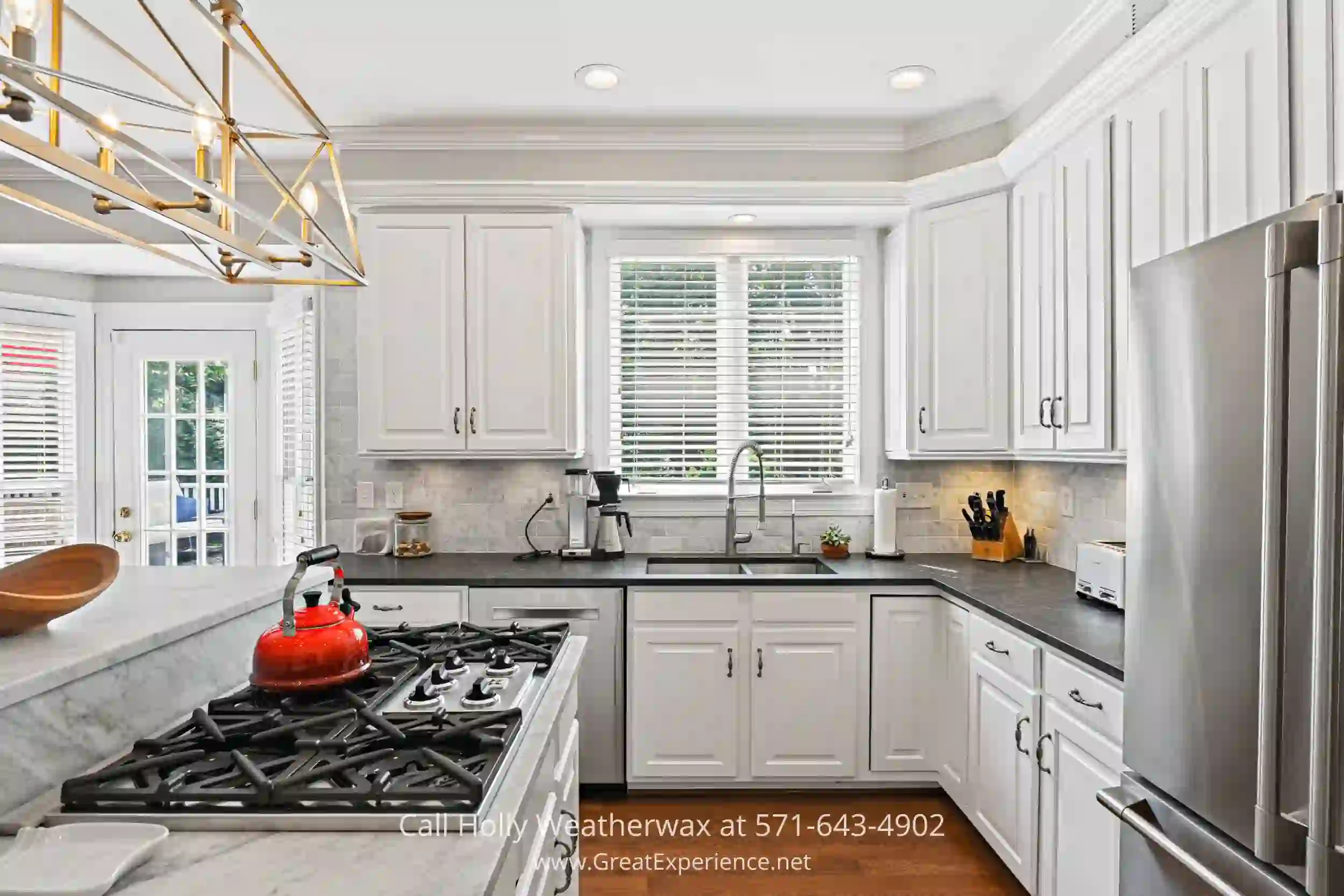 a kitchen with a stove top oven next to a refrigerator