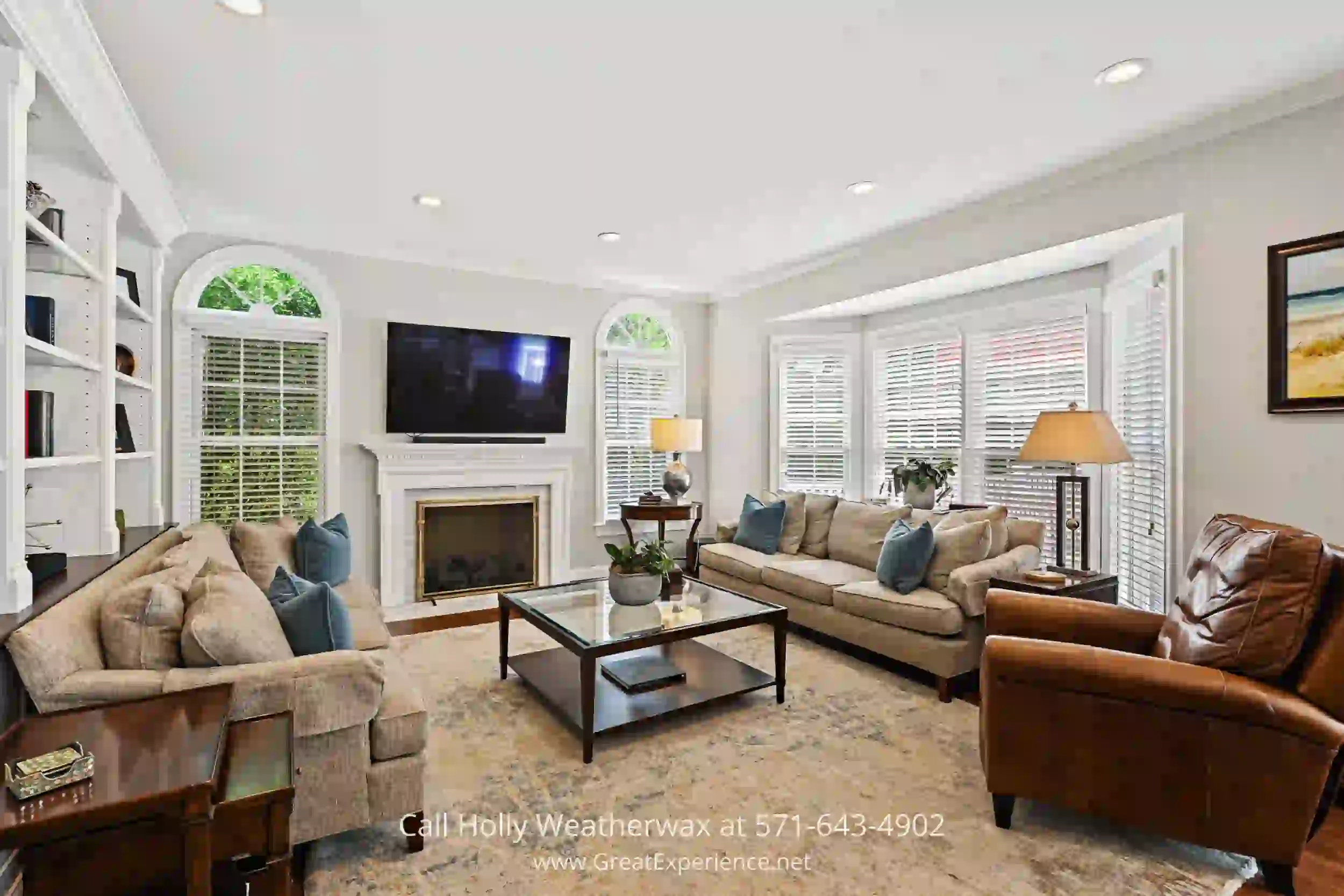 a family room filled with furniture and a fire place