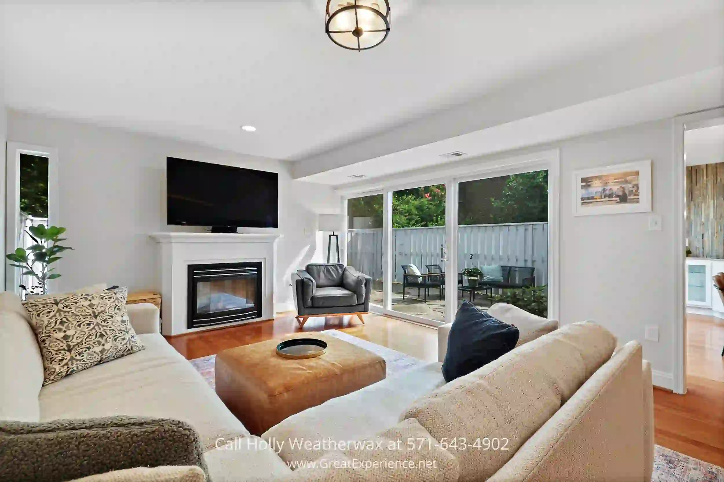 a living room filled with furniture and a gas fire place