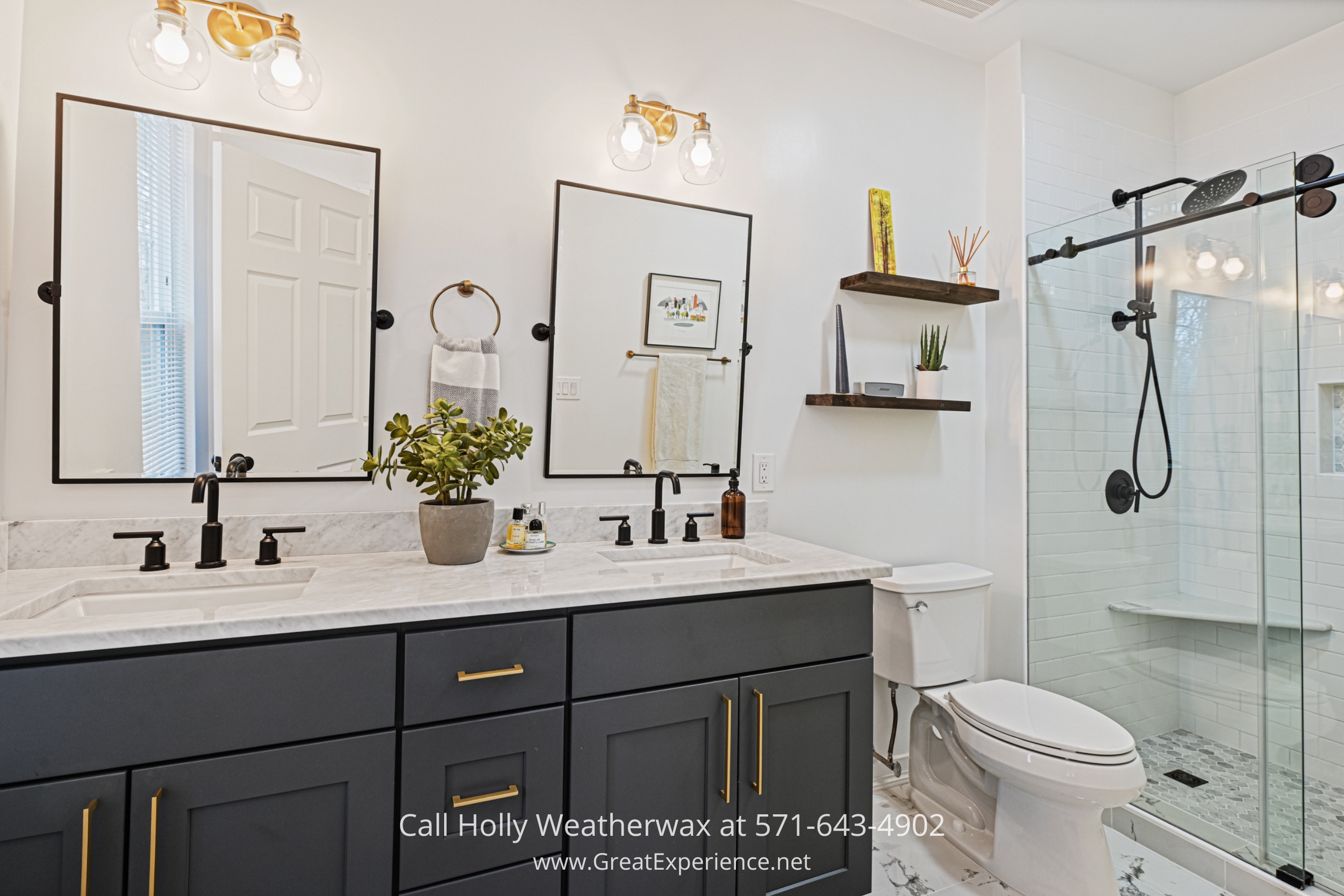 a bathroom with two sinks, a toilet and a shower