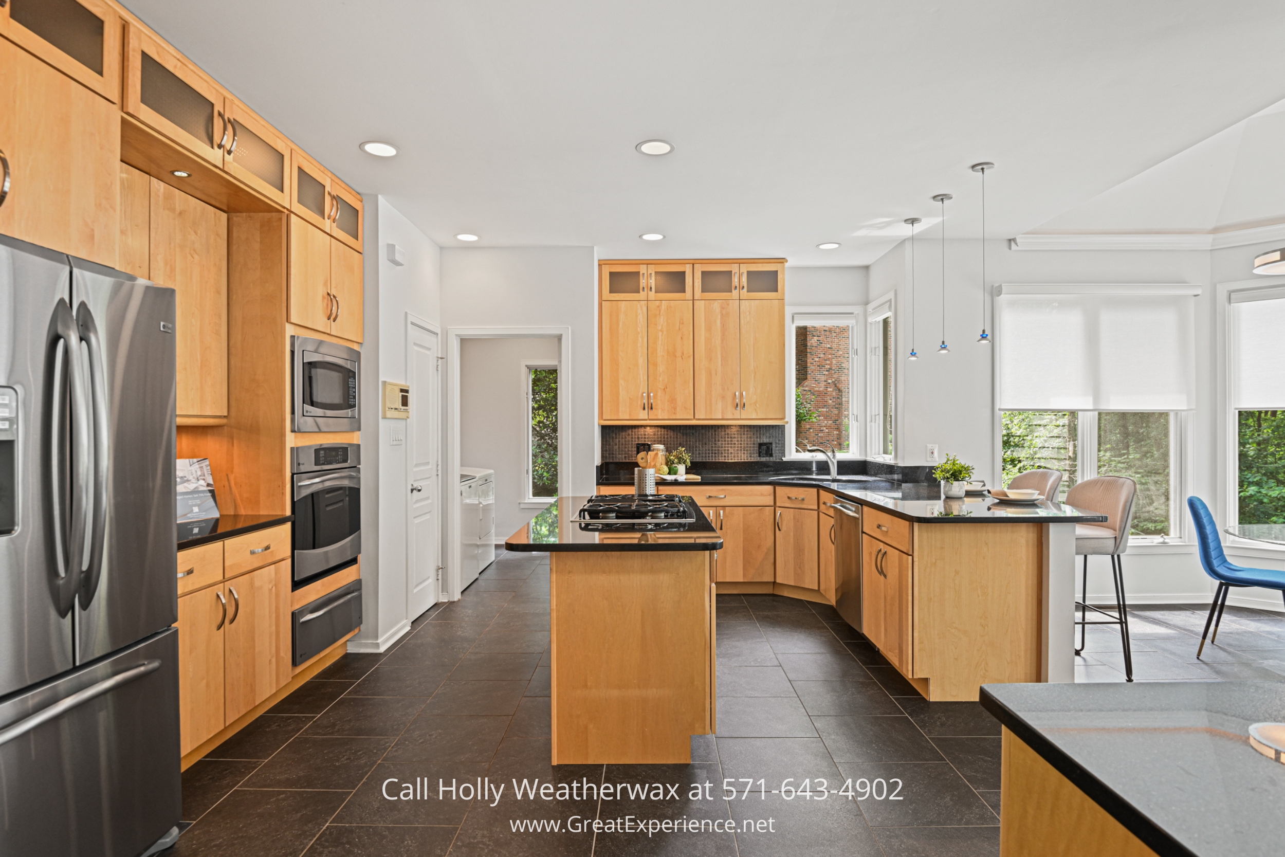 a kitchen with a refrigerator and a stove