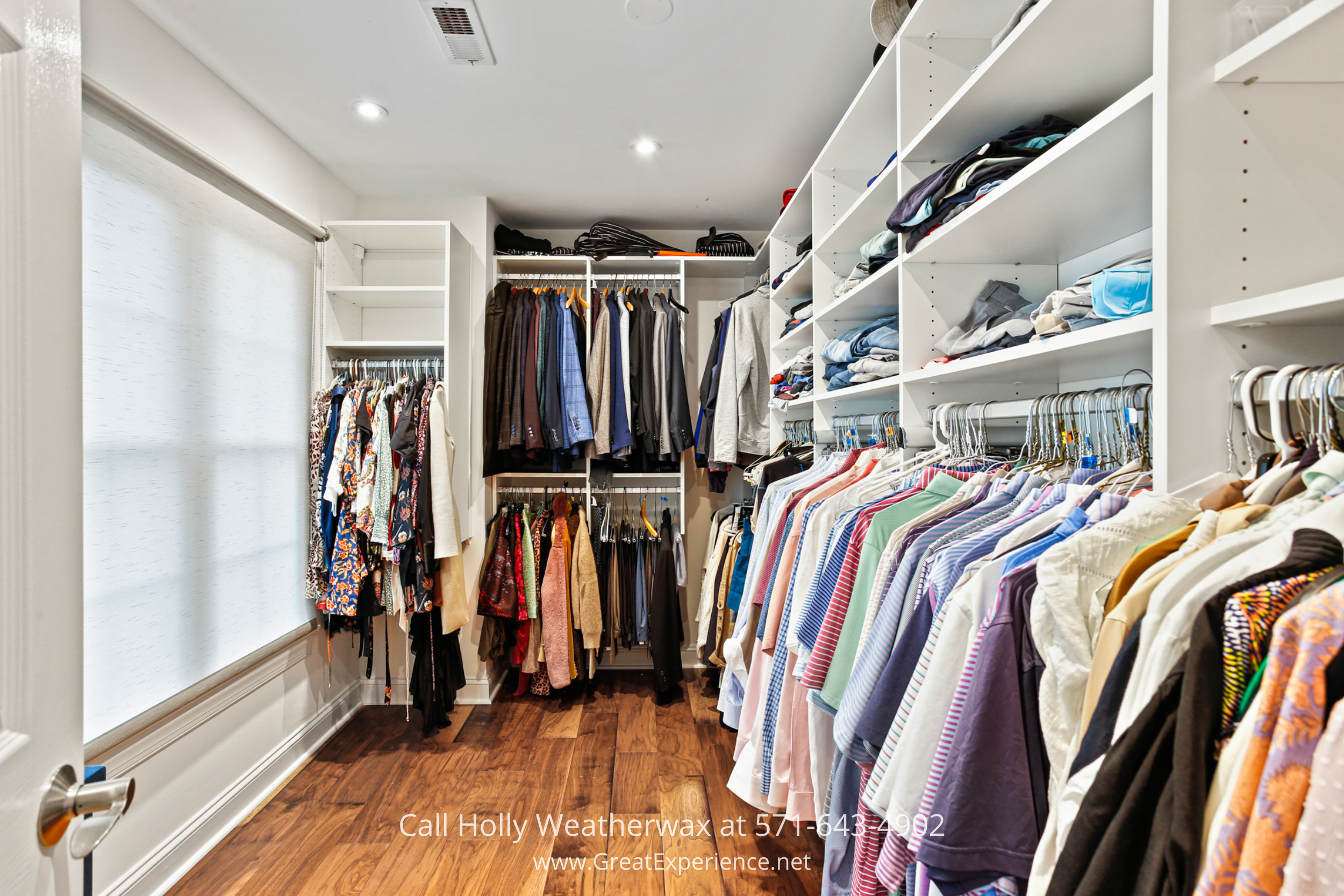 Custom walk-in closet at 1110 Round Pebble Lane, Reston, VA, with built-in shelving, hanging space, and hardwood floors.