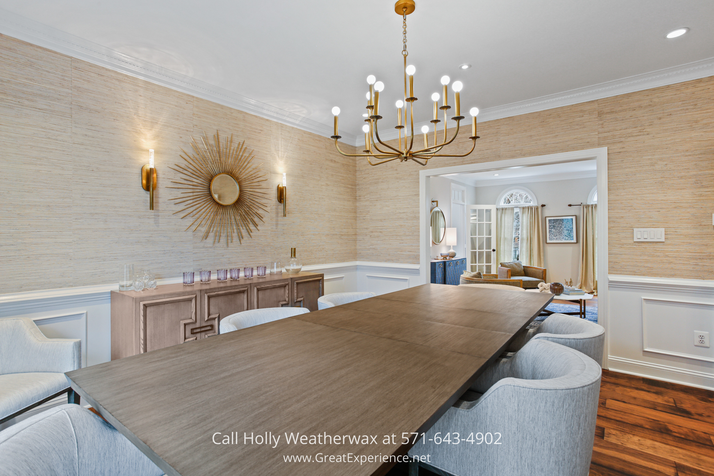 Formal dining room at 1110 Round Pebble Lane, Reston, VA, featuring hardwood floors, designer chandelier, and elegant wall detailing.