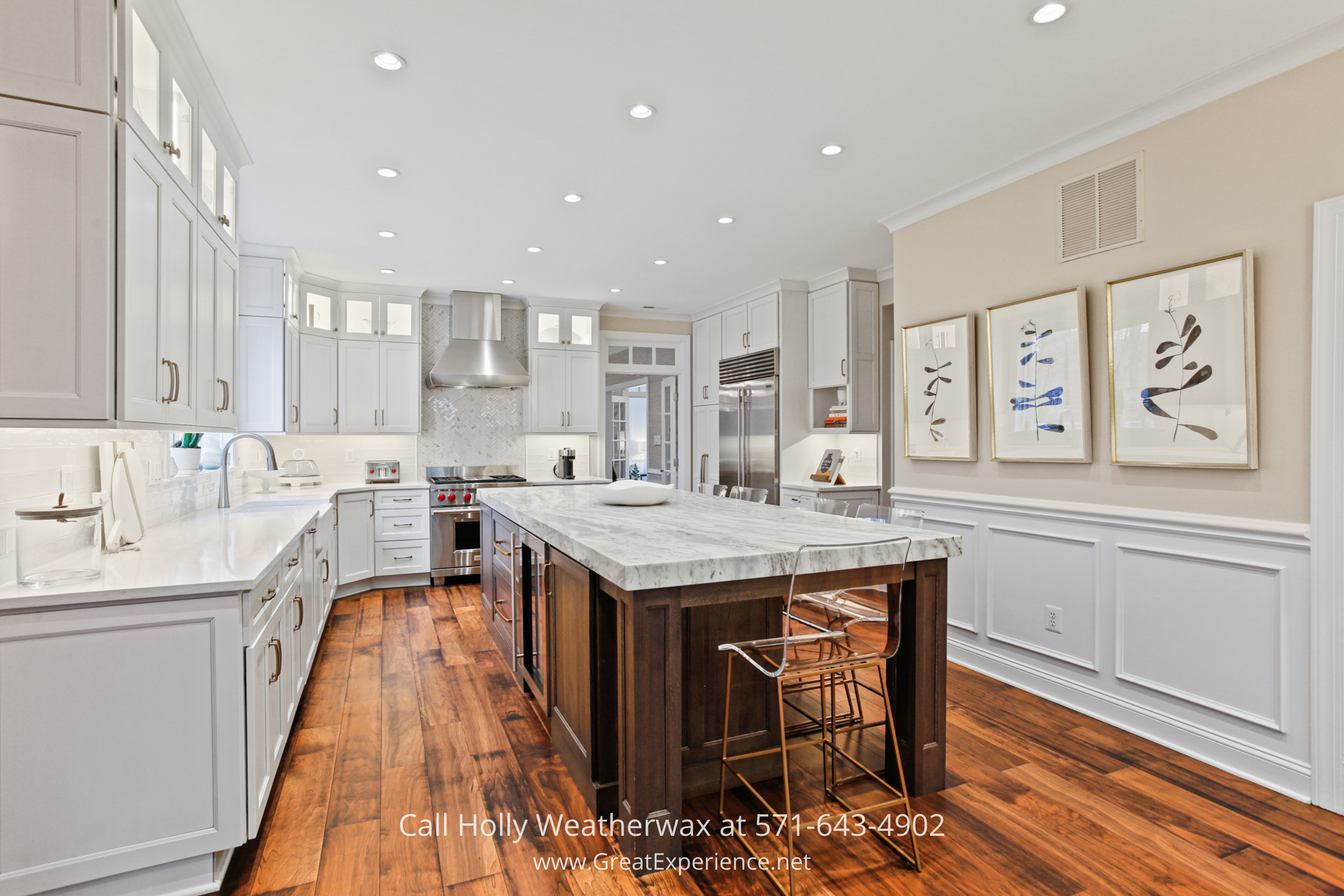 Chef’s kitchen at 1110 Round Pebble Lane, Reston, VA, featuring a large center island, high-end appliances, and custom cabinetry.