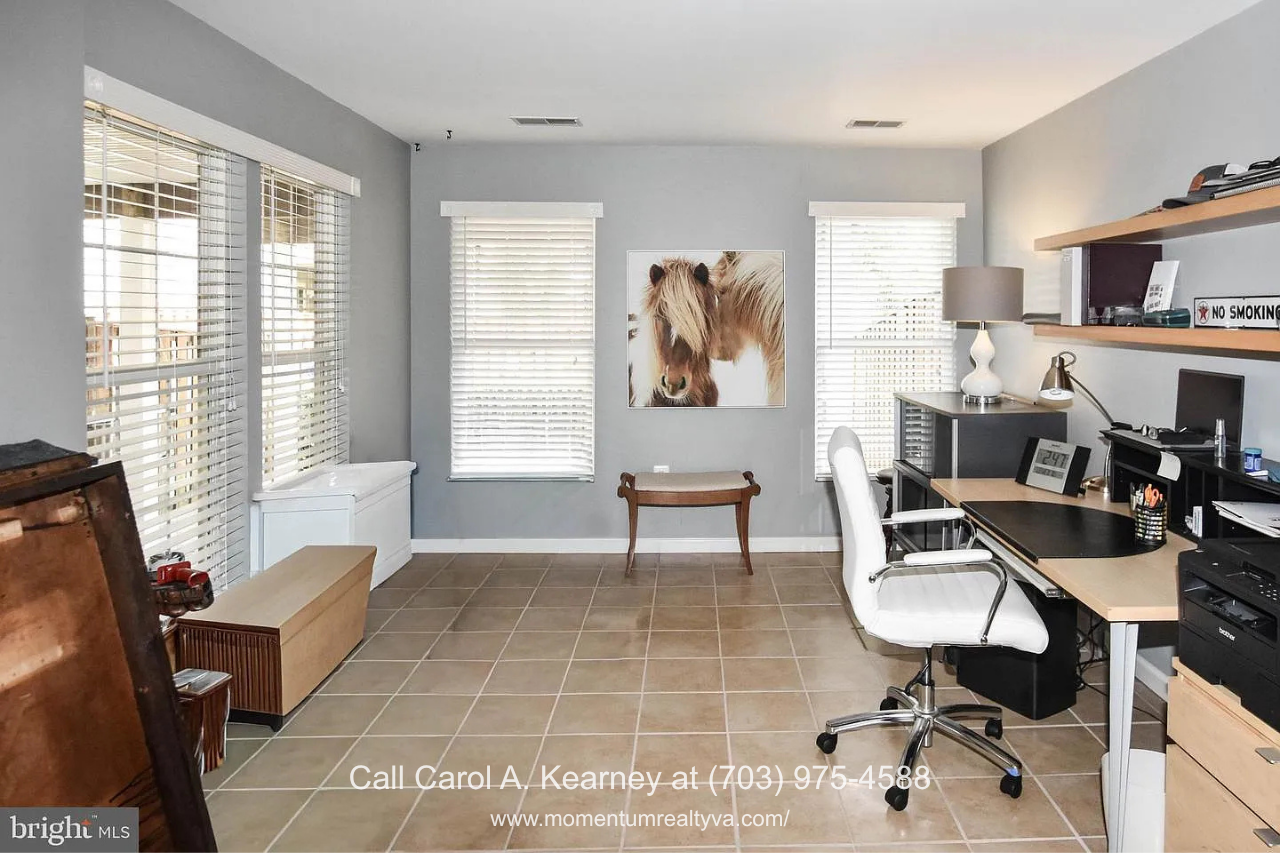 Home Office – 25474 Brickell Dr Spacious home office at 25474 Brickell Dr in South Riding, Chantilly, VA, featuring multiple windows, natural light, and ample workspace.