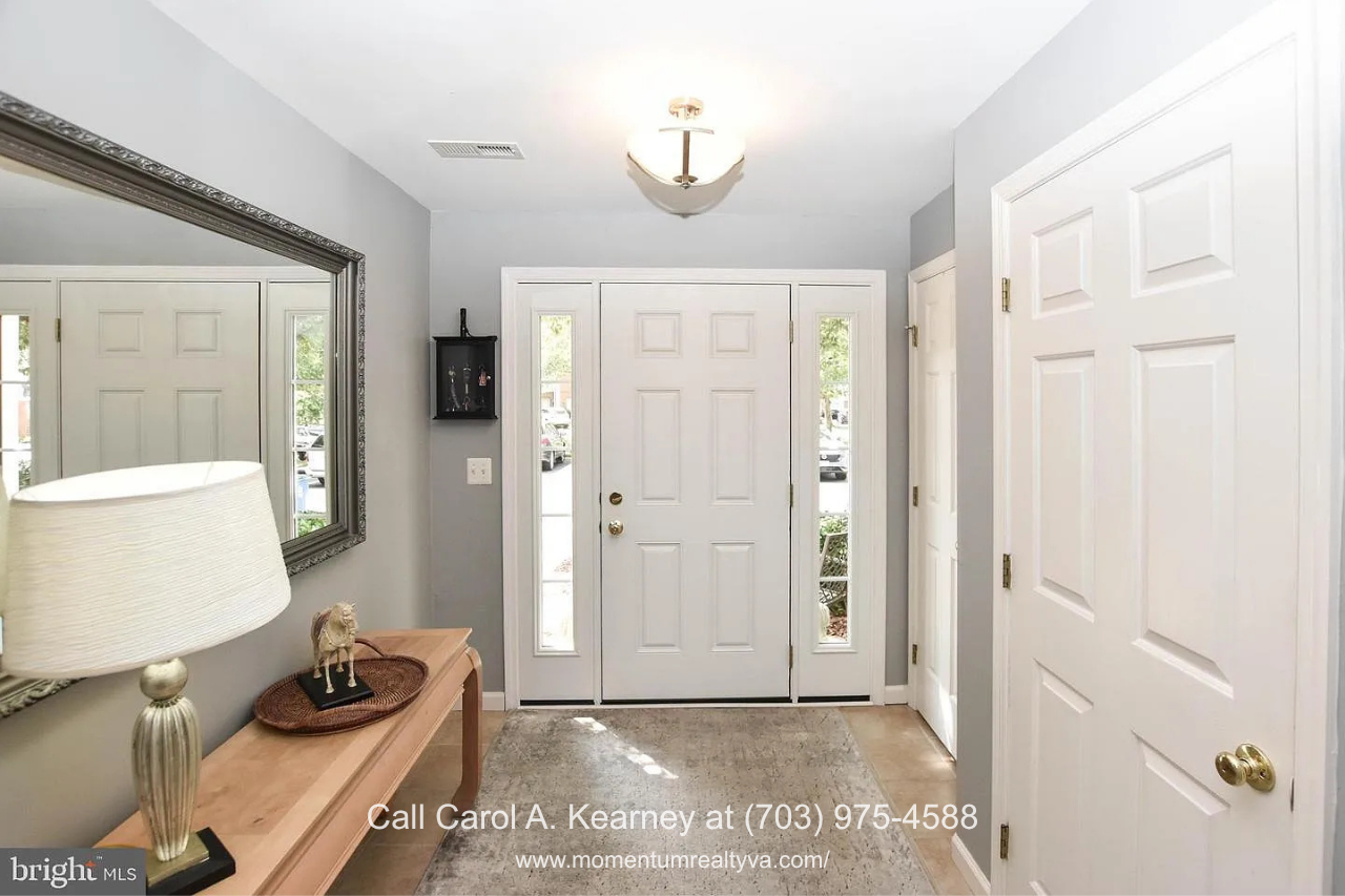 Welcoming Entryway – 25474 Brickell Dr, Chantilly VA Bright and welcoming entryway at 25474 Brickell Dr in South Riding, Chantilly, VA, featuring a ProVia entry door with sidelights.