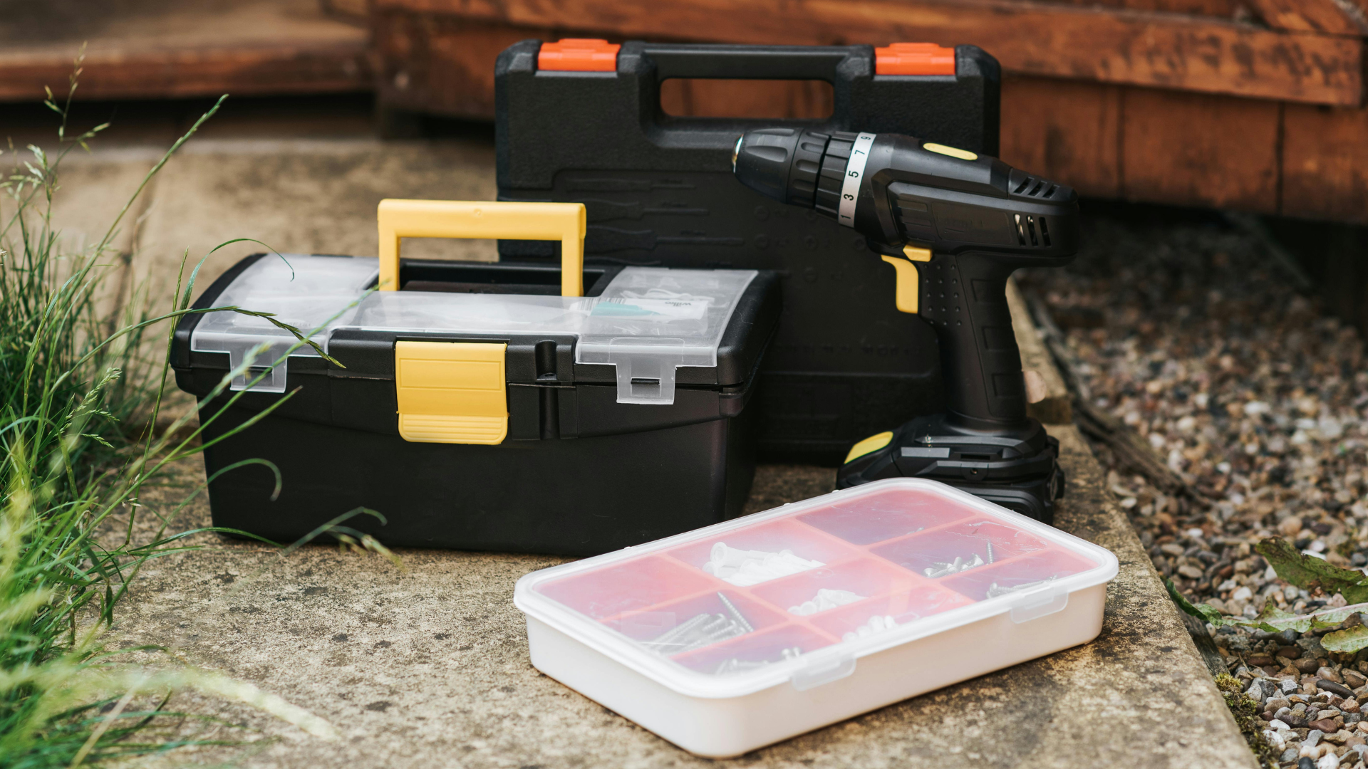 DIY Home Repairs Tool Box A toolbox showcasing a drill, screwdriver, and other essential tools for DIY home repairs.