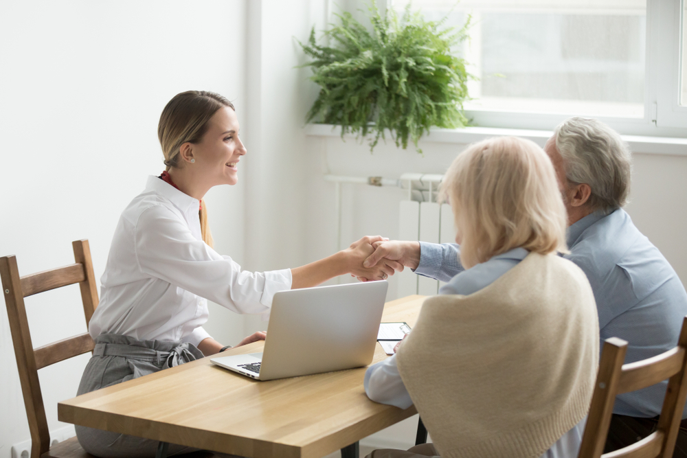 Homebuyer shaking hands with the real estate agent