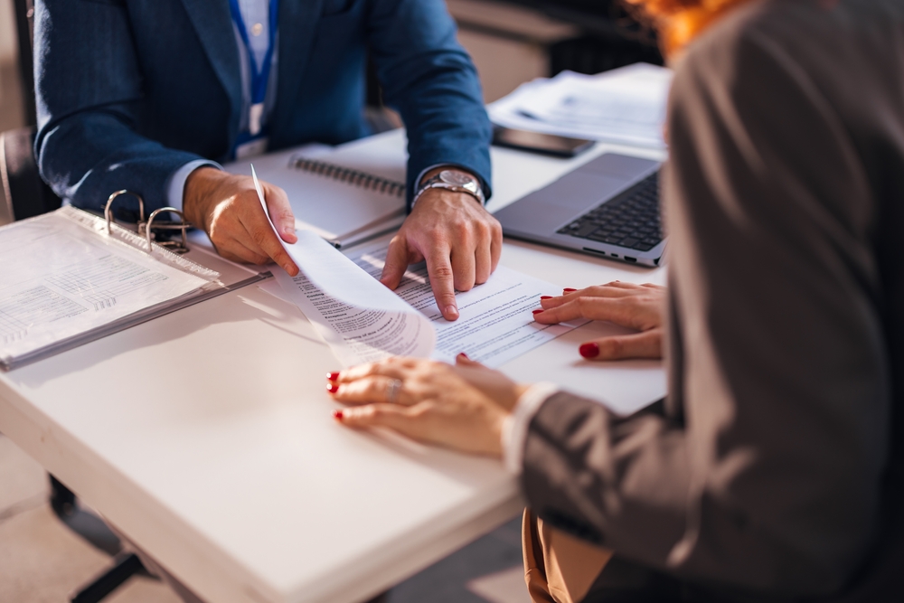 two people discussing a contract