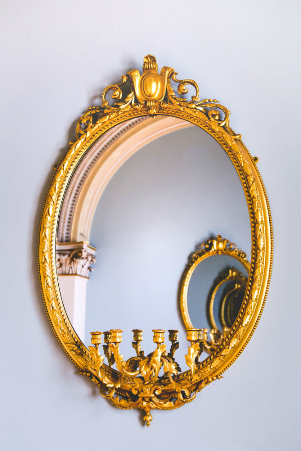 Big Detailed Gold Mirror on Wall