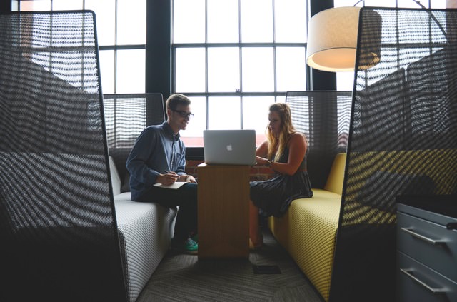 Two people working together in a modern and stylish workspace