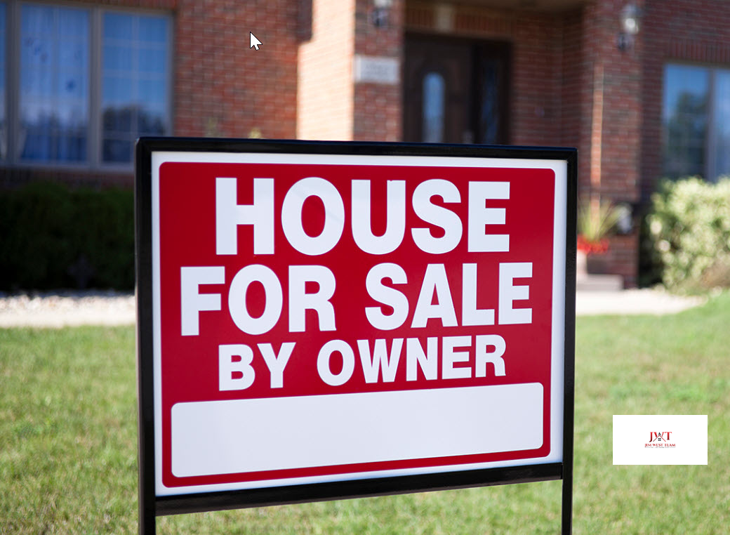 Red and white For Sale by Owner sign in front of a brick home, representing an FSBO property in Marysville, Ohio