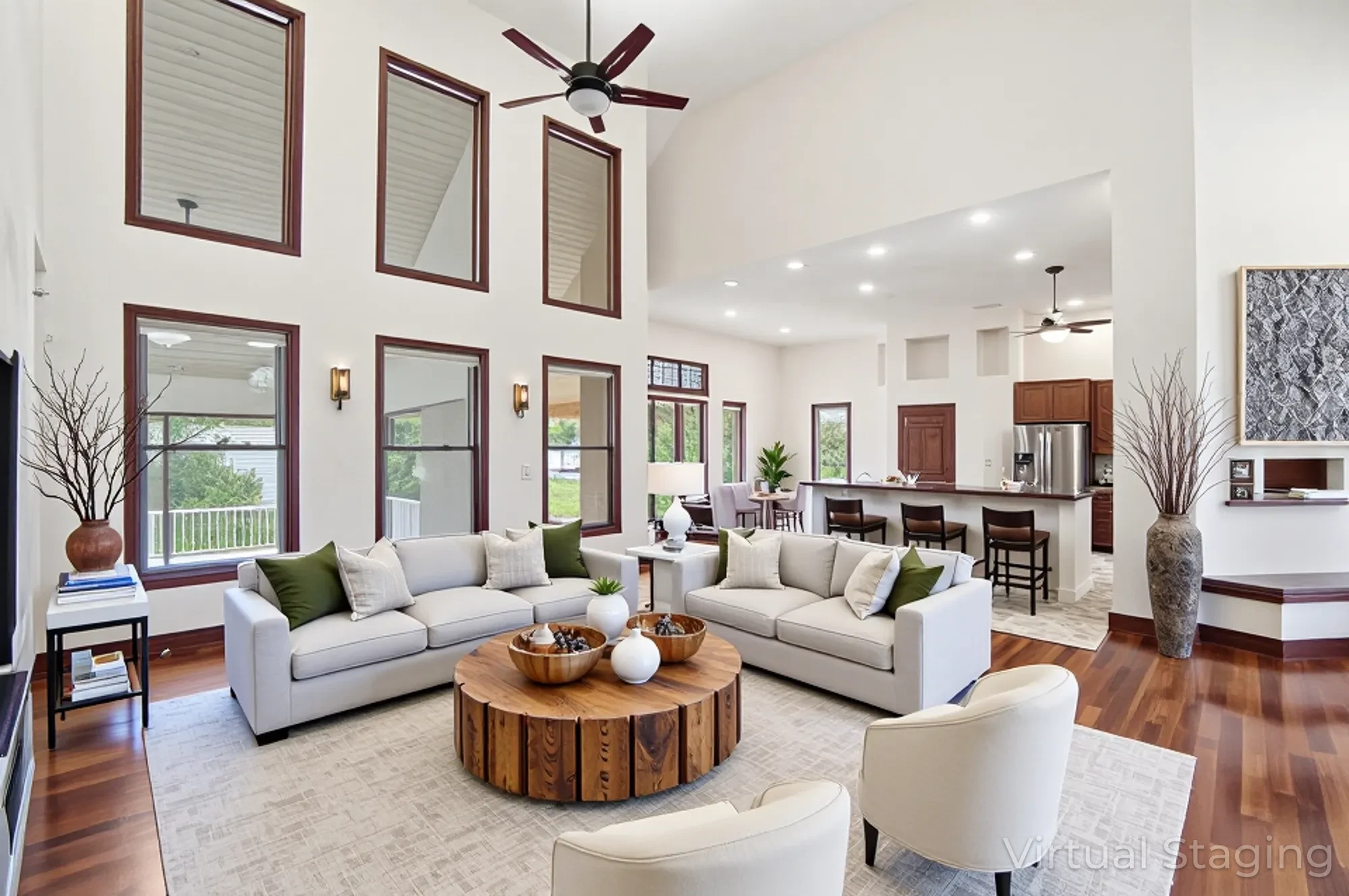 Great room with vaulted ceilings, Brazilian cherry hardwood floors and abundant natural light in Green Pastures custom home