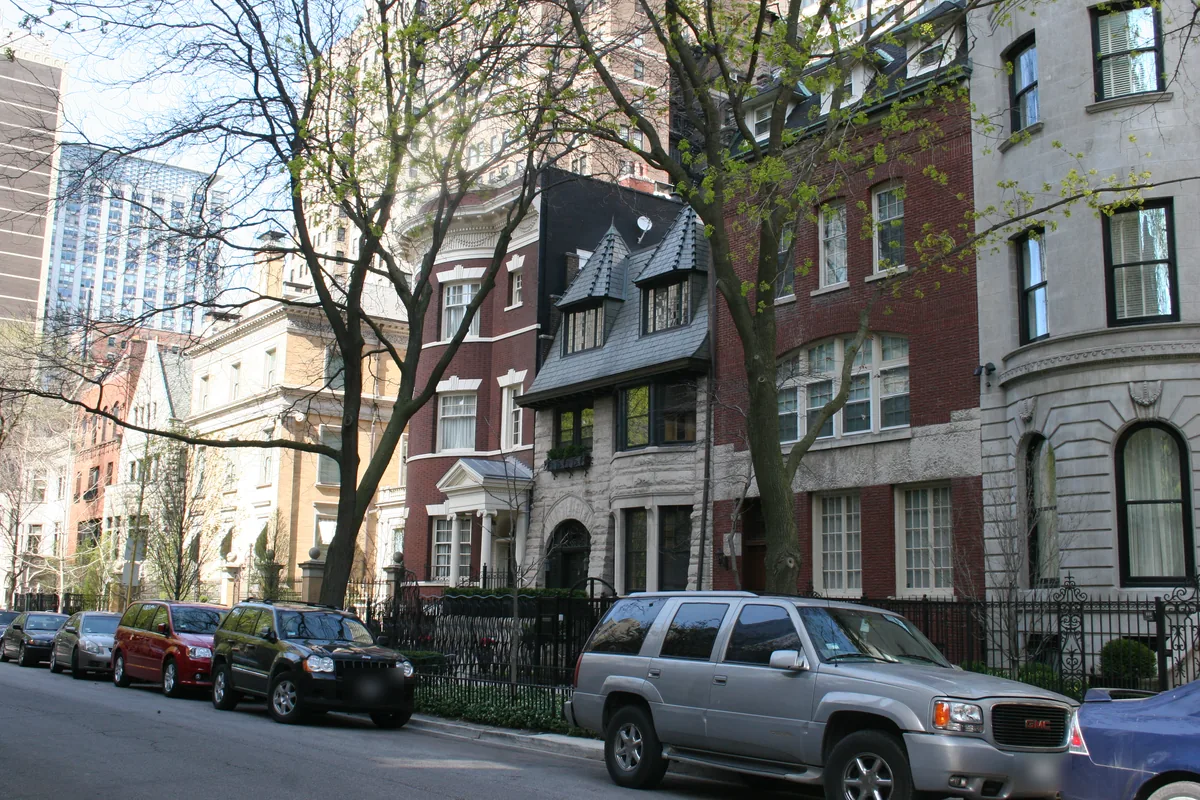 Historic row houses and mansions on Astor Street in the Gold Coast, Chicago, with high-rises behind