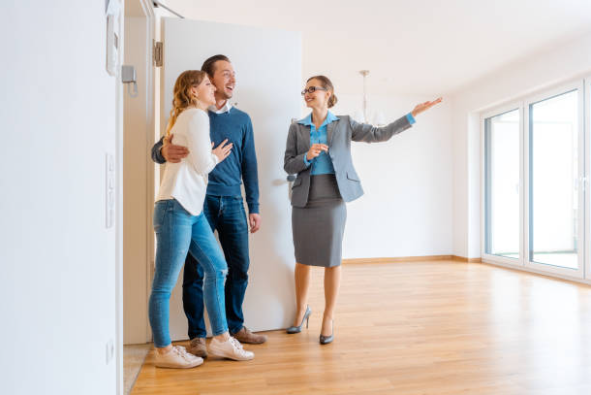 Homebuyers touring a home in Greensboro, NC with an Advantage Build Real Estate agent