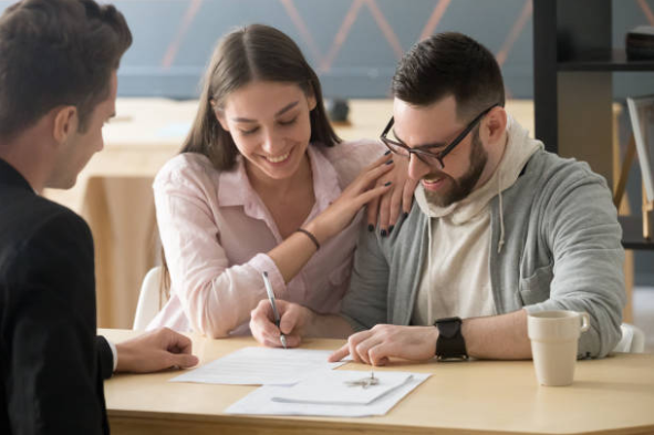Homebuyers closing on their new home in Greensboro, NC