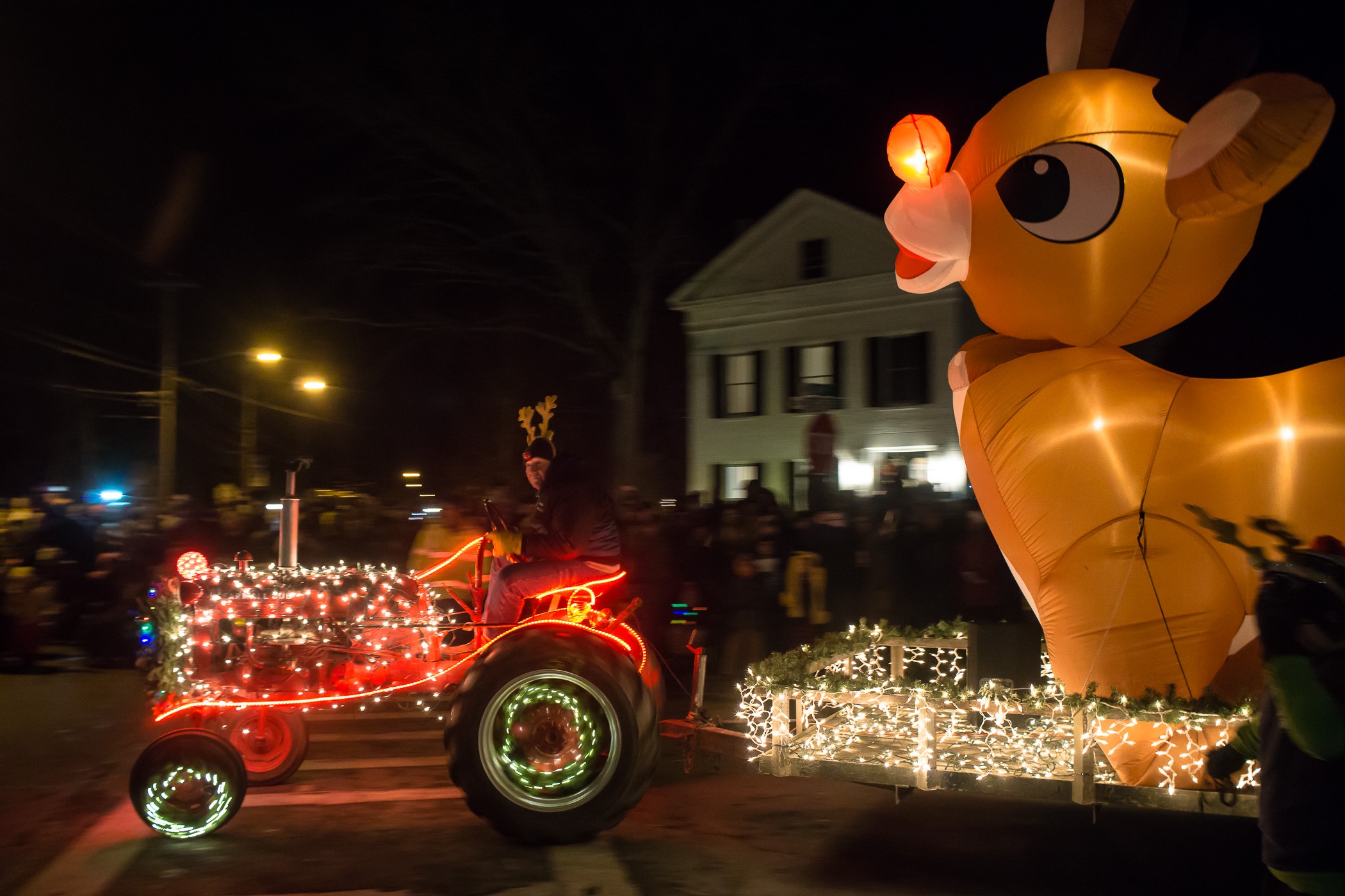 A photograph of a tractor pulling a reindeer float in Greenwich, NY by ©JustusWaldron.