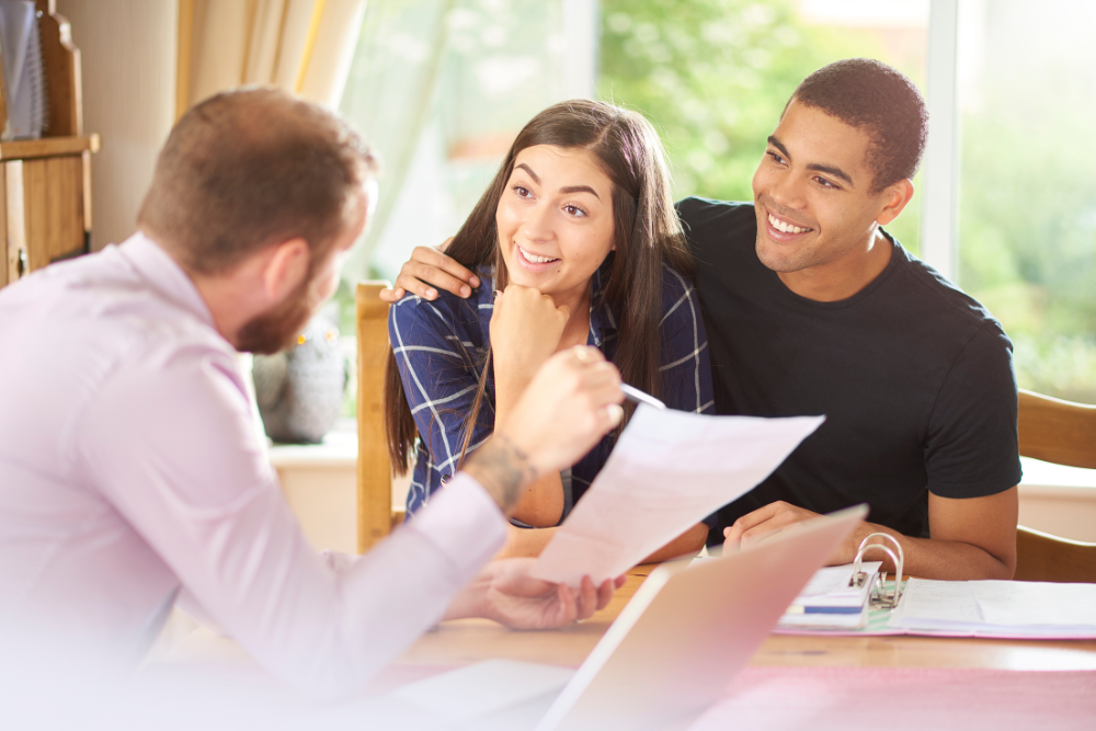 real-estate-agent-advising-clients real estate agent advising clients