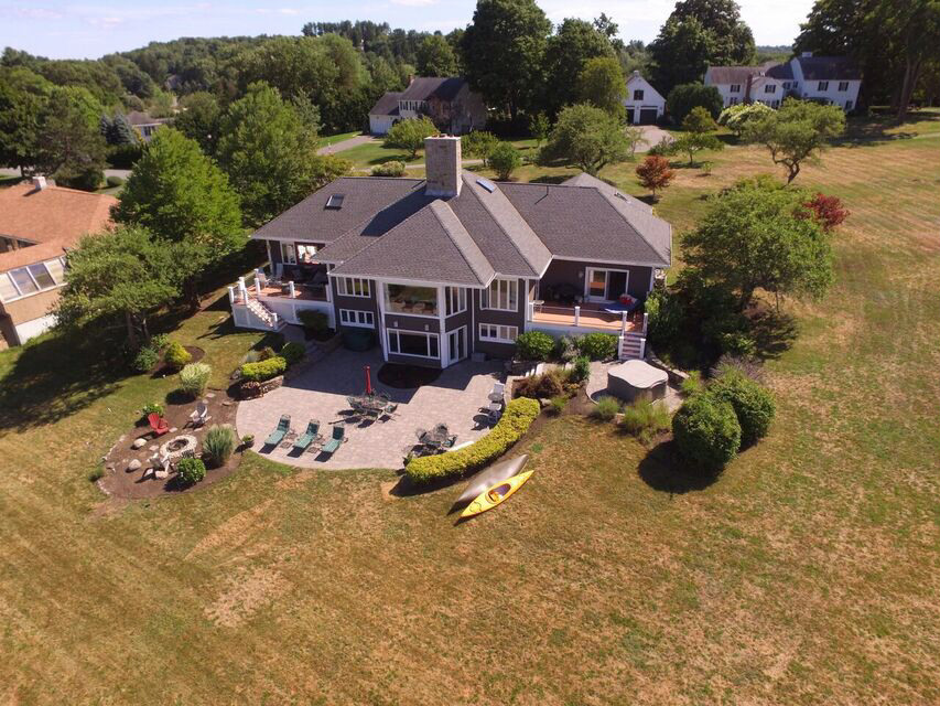 Decks And Patios Danvers  Oversized windows with water views, two decks, stone patio, fire pit and much more. This is an exquisite home you won't want to miss!