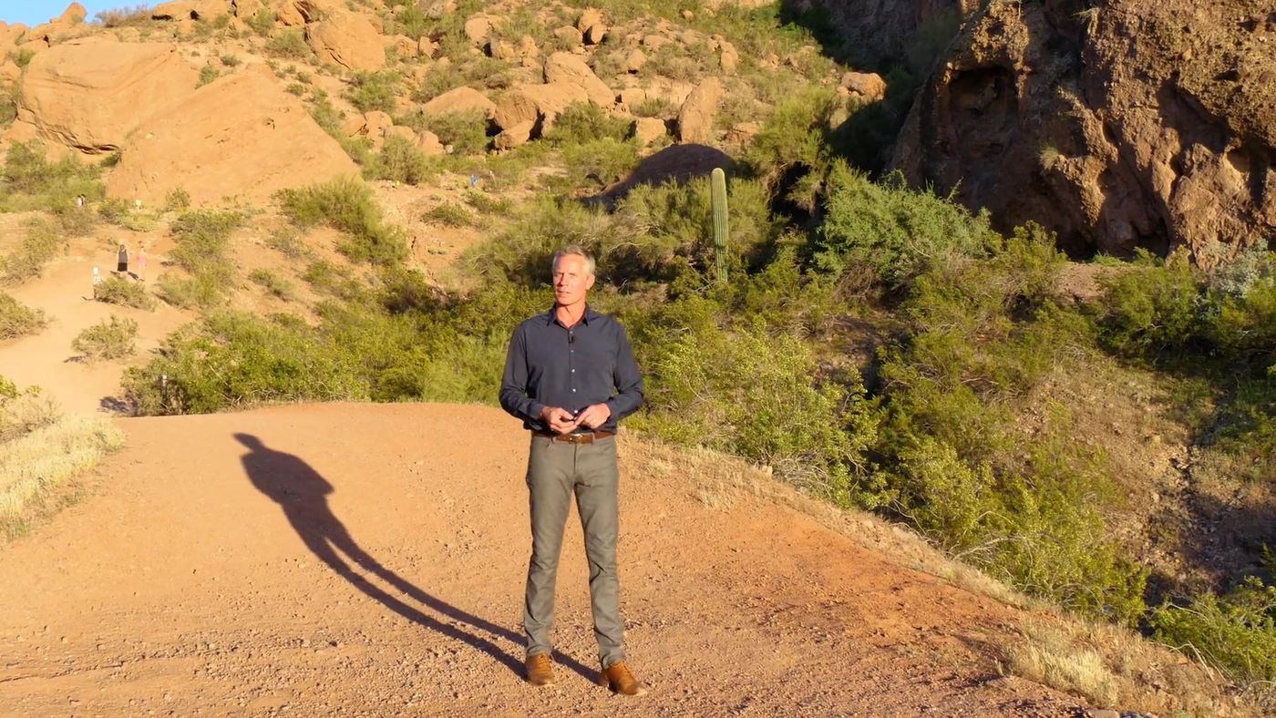 Mark Thomas presenting on Camelback Mountain above Paradise Valley
