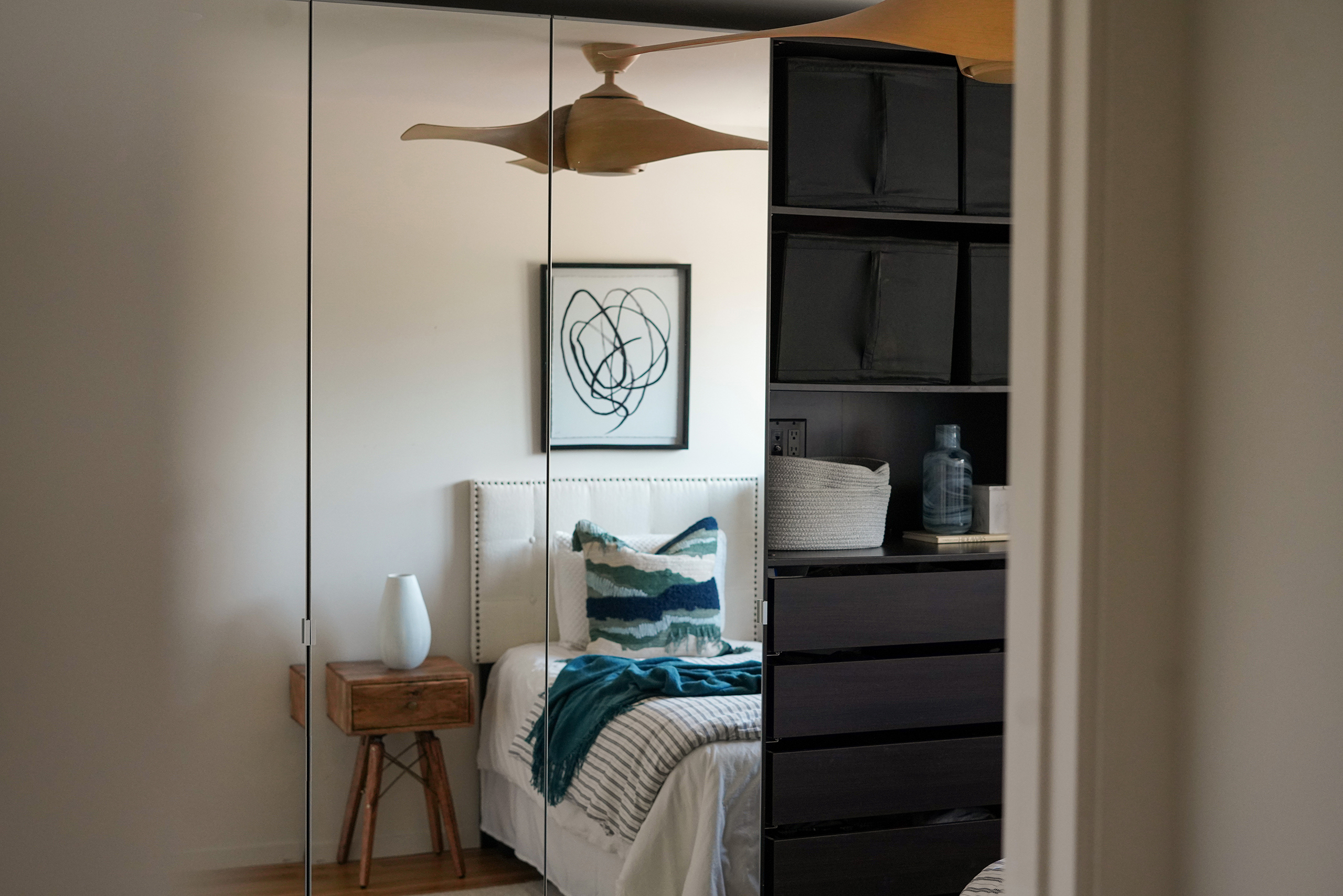 a modern bedroom with blue pillows