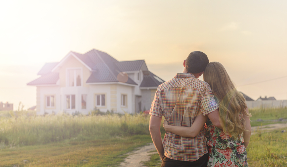 a couple looking at a house