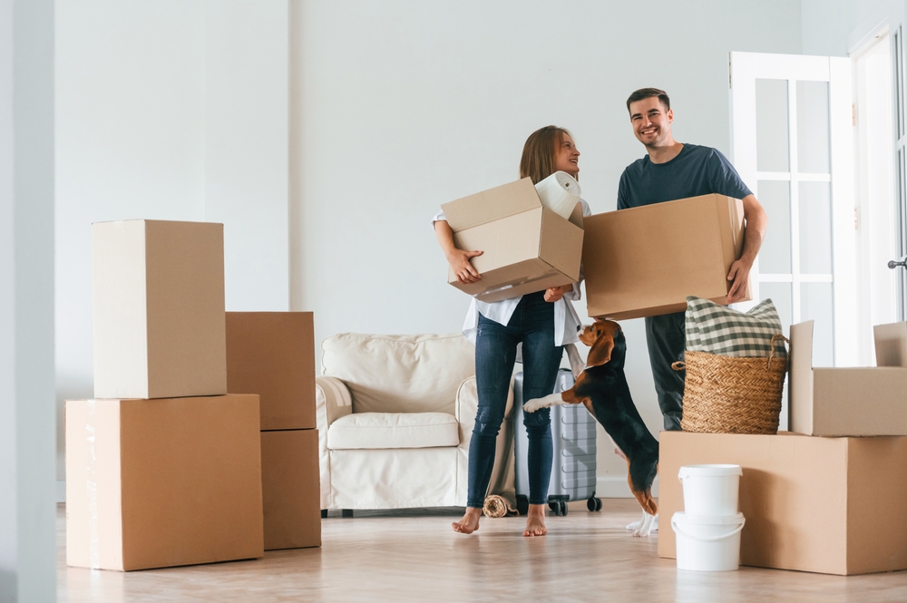 a couple holding boxes